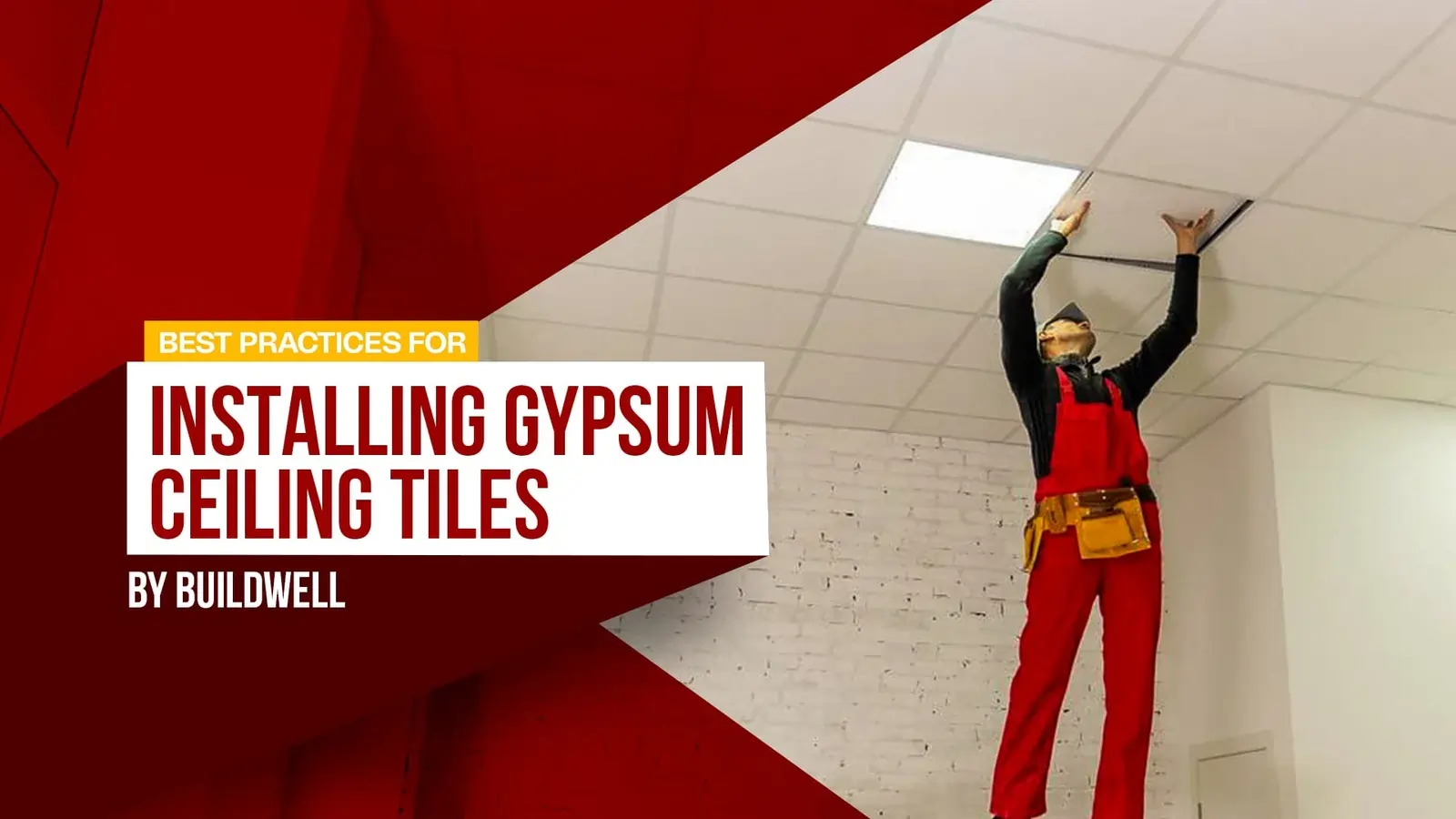 A professional in a red uniform and safety gear installing gypsum ceiling tiles in a modern interior, demonstrating Best Practices for Installing Gypsum Ceiling Tiles