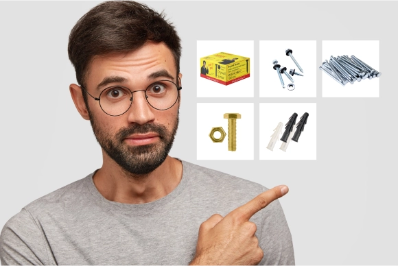 Man pointing towards Buildwell accessories including screws fasteners bolts nuts and wall plugs for fasteners fixings