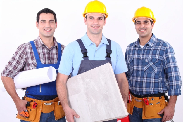 Group of construction workers with hard hats tools and building materials representing who Buildwell serves and understanding our customers