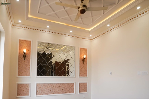 Modern living room with luxury false ceiling design gypsum boards LED lighting and decorative wall panels showing why Buildwell is Indias most complete ceiling interior product brand