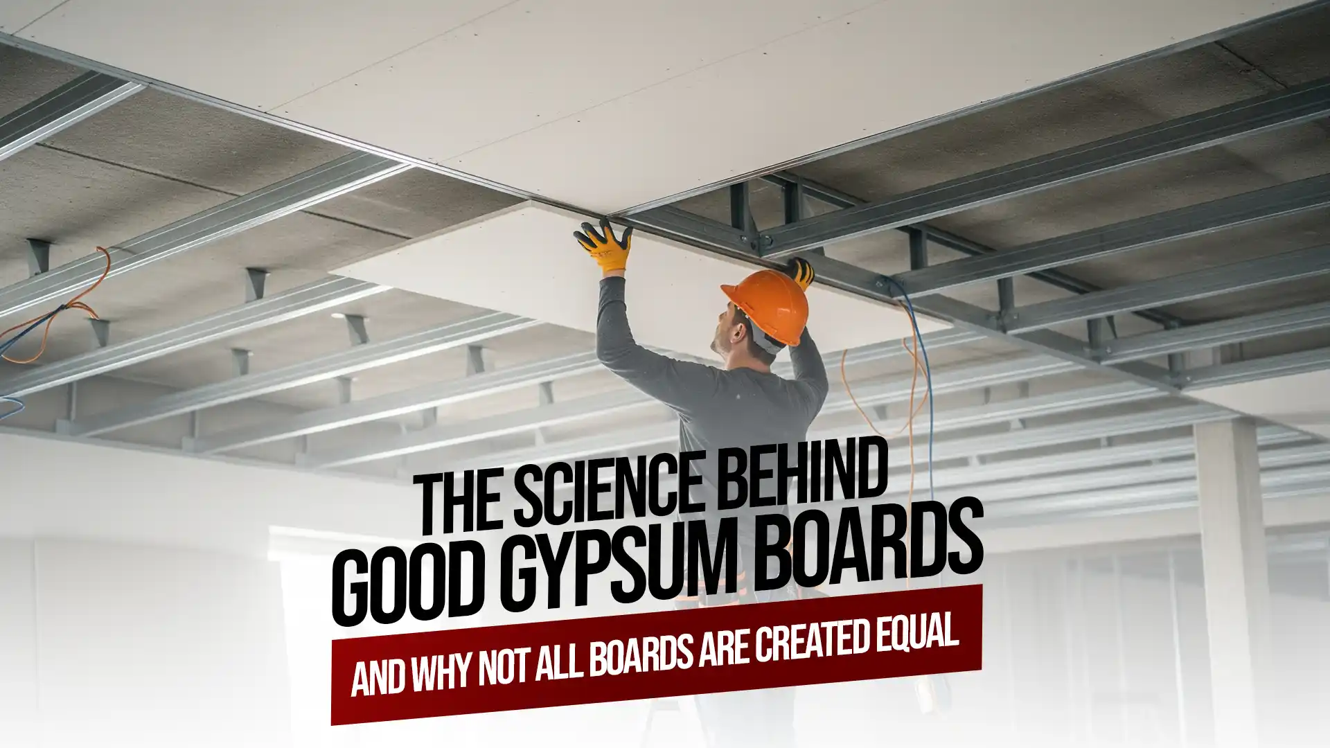 Worker installing gypsum boards on a ceiling framework demonstrating the quality and strength of gypsum boards