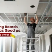Worker installing ceiling boards supplied by the Best Gypsum Board Supplier in India for durable, smooth interiors