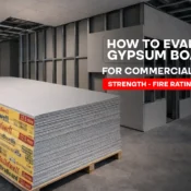 Stacked gypsum boards at a commercial site, highlighting strength, fire rating, and coverage considerations for gypsum boards