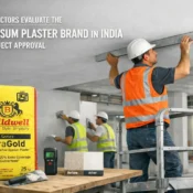 Contractors inspecting wall finish using the Best Gypsum Plaster Brand in India for smooth and durable interior surfaces