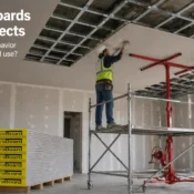 gypsum boards installation on ceiling in construction site showing workers fitting drywall panels for interior finishing