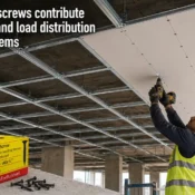 gypsum screw installation in ceiling system showing worker fixing drywall panels with precision and alignment