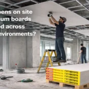 Construction workers installing gypsum boards on a false ceiling framework at a commercial site, representing the Best Gypsum Board Brand in India