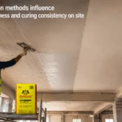 Worker applying gypsum plaster on ceiling surface using premium gypsum plaster products for smooth finishing and consistent curing performance