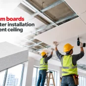 Gypsum Boards being installed on a suspended metal ceiling framework by workers to support faster installation and consistent finishing