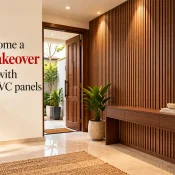 PVC Panels for Walls featuring a modern home entrance with vertical wood-textured wall panels, warm lighting, a floating console table, and decorative indoor plants
