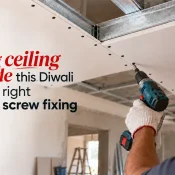 Construction worker using a power drill to install a Gypsum Screw into a gypsum board ceiling attached to metal framing, with multiple screw heads visible along the board edges